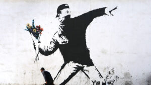 Protesting with flowers by Banksy