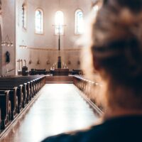 Woman in catholic church for prayer