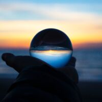 Hand holding glass ball